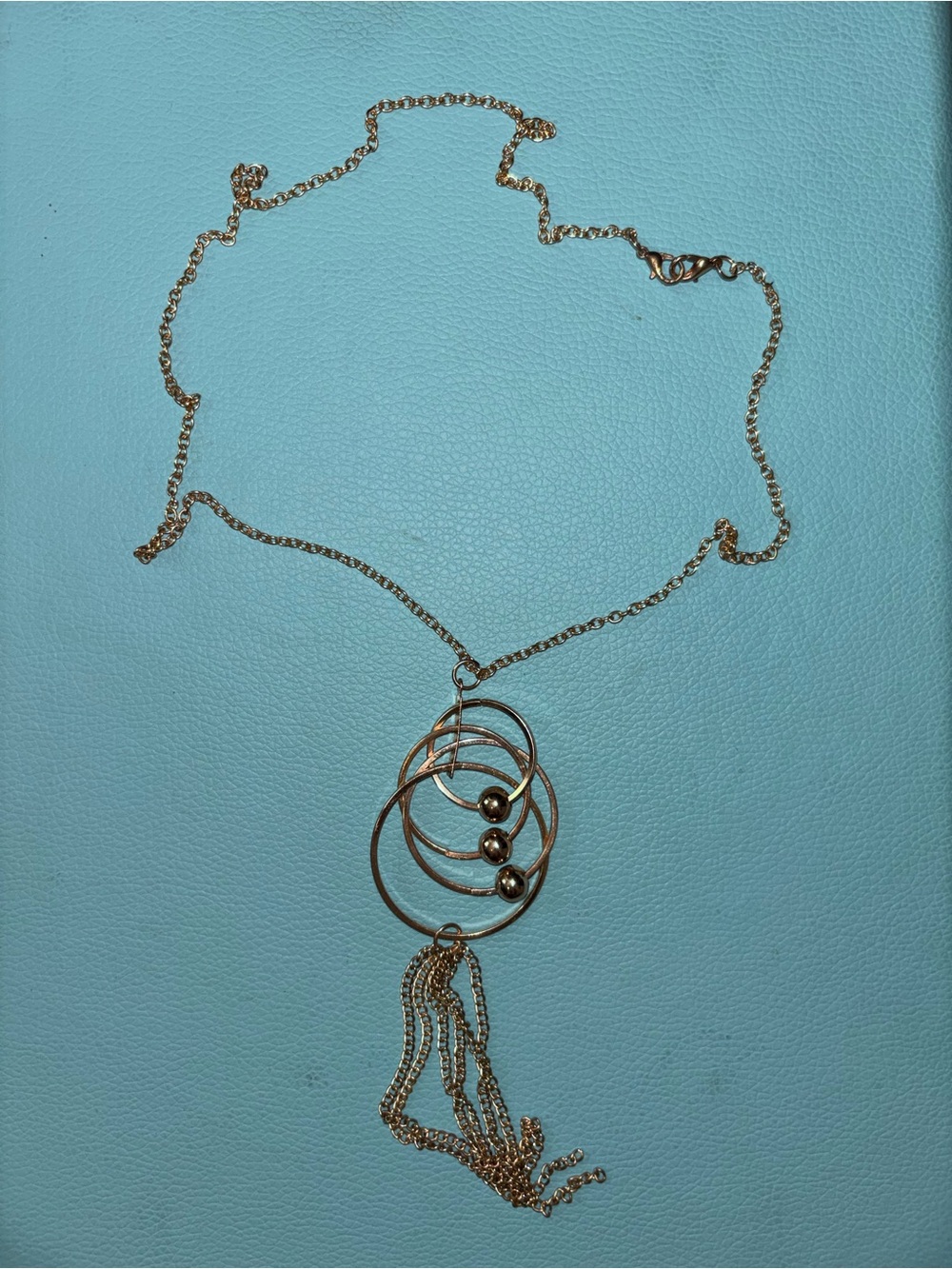 Gold-Tone Multi-Ring Pendant Necklace with Tassel